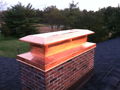 Before and after chimney cap replacement in Roslyn, NY