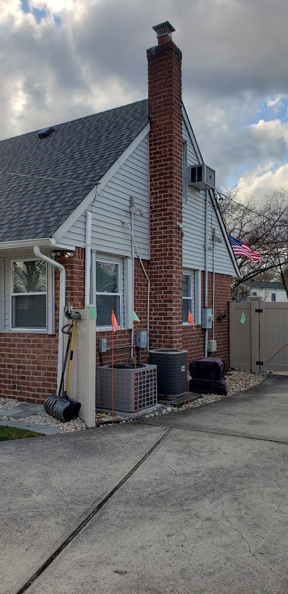Professional chimney repointing restoring brick joints in Roslyn, NY
