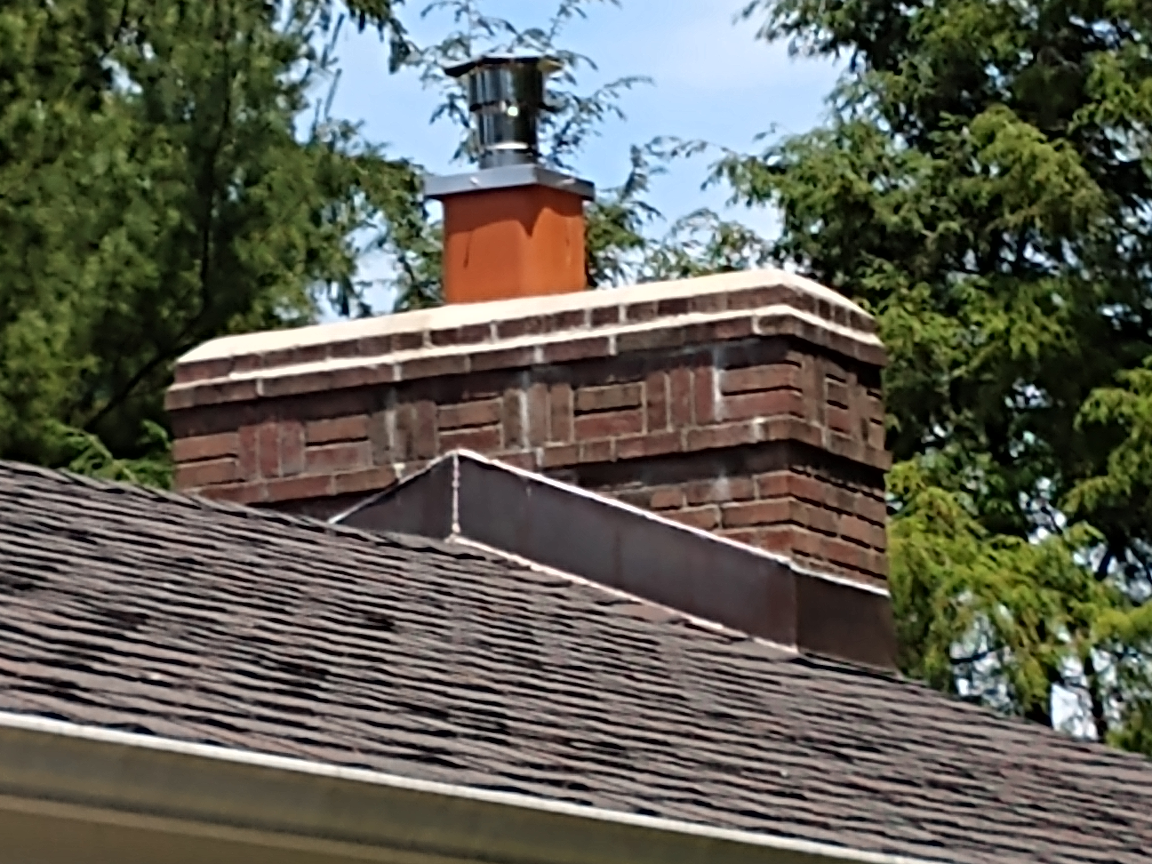 Stainless steel chimney cap with animal guard in Roslyn, New York